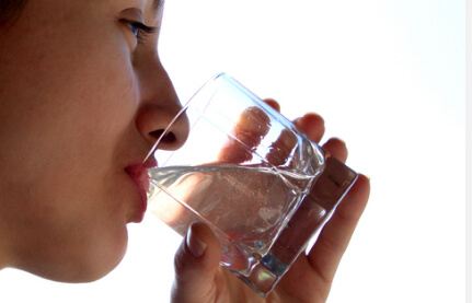 Woman Drinking Ionic Colloidal Silver Button Colloidal Silver