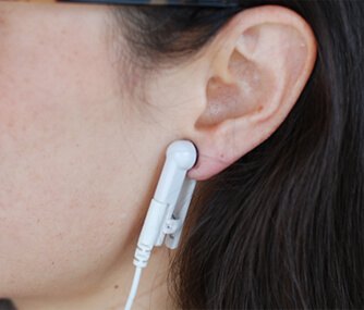 Image of Person Wearing Brain Tuner Earclips